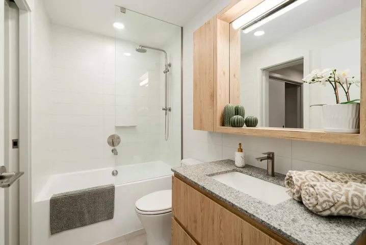 Full bath with vanity, shower / bathtub combination, decorative backsplash, and recessed lighting
