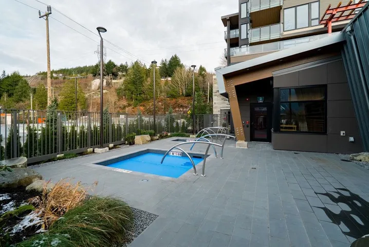 View of hot tub and cold plunge featuring a patio and seating area