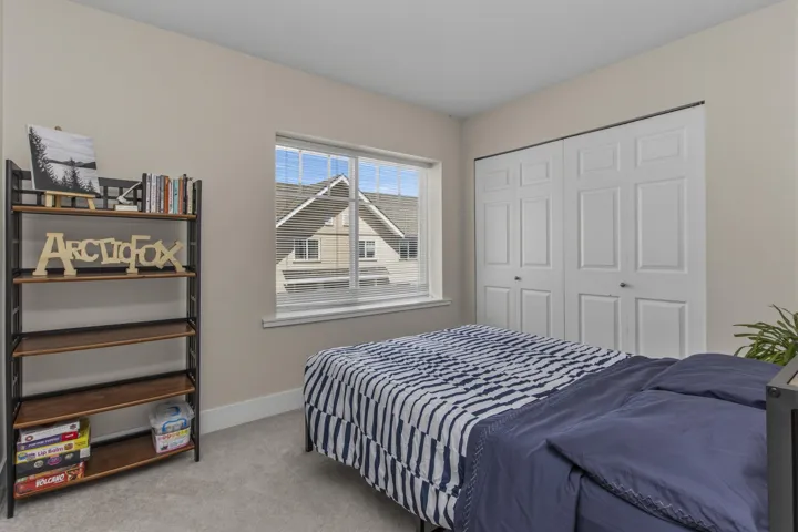 Neutral-toned walls complement light gray carpeting