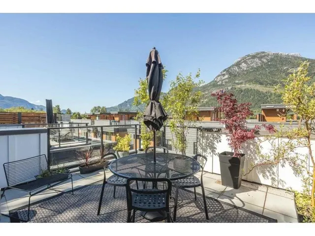 View of patio with a mountain view and outdoor dining space