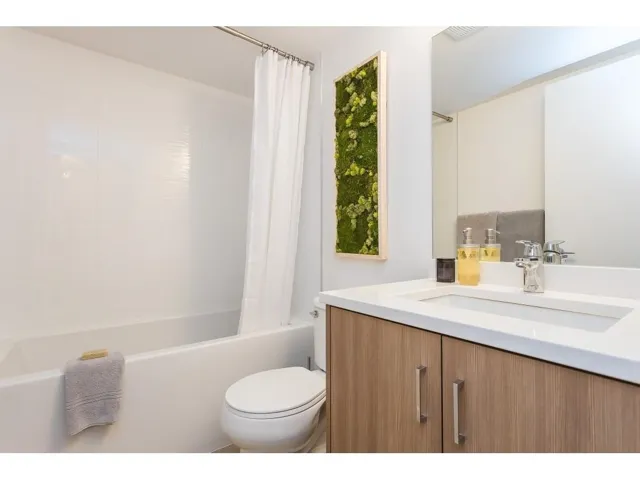 Bathroom with vanity and shower / bath combo