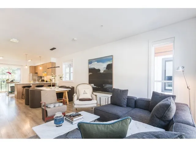 Living room with healthy amount of natural light and light wood-type flooring