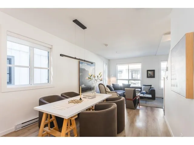 Dining space featuring light wood-style floors and baseboard heating