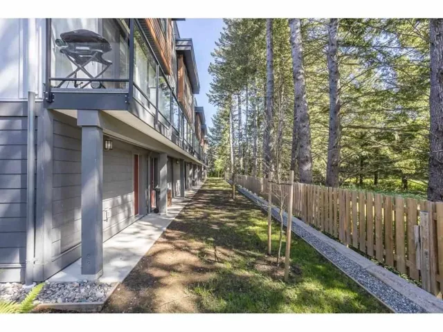 View of yard featuring a balcony