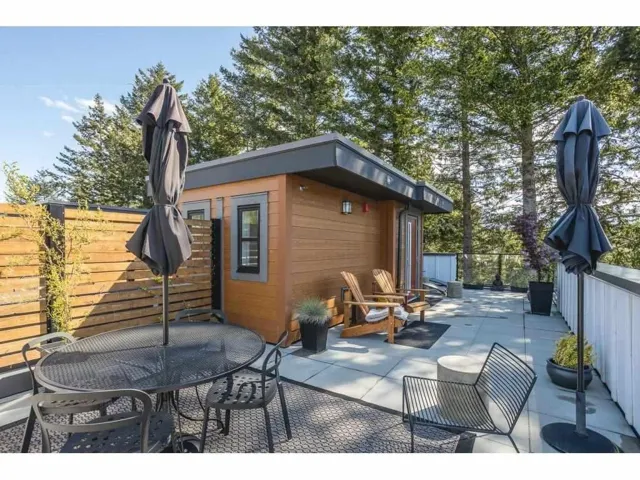 View of patio / terrace featuring outdoor dining area and an outdoor structure