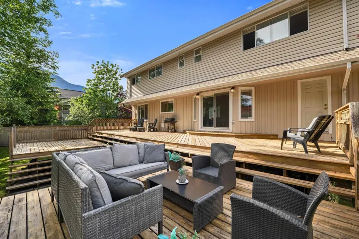 Multi-level wood decking provides extensive outdoor living space
