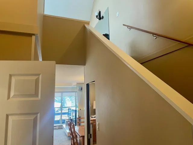 Stairs featuring a high ceiling