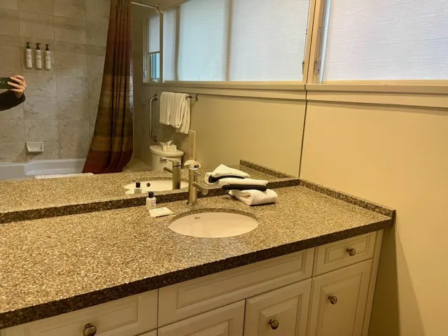 Bathroom featuring vanity and shower / tub combo