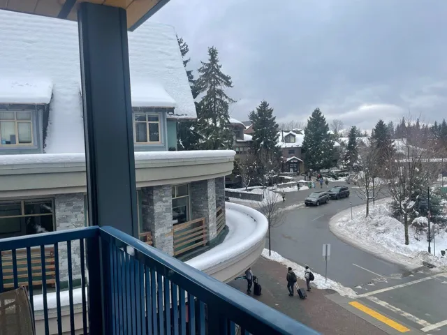 View of snow covered back of property