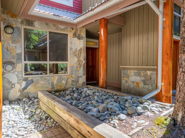 Property entrance with stone siding