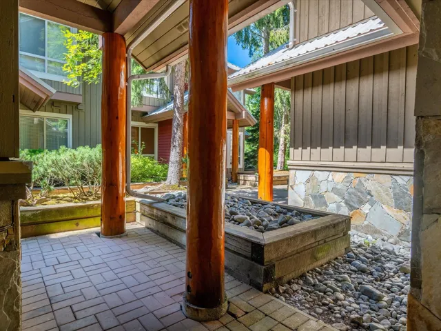 View of patio with an outdoor fire pit