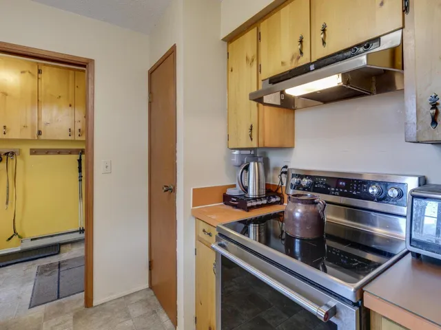 Broom closet or Pantry with mudroom beyond
