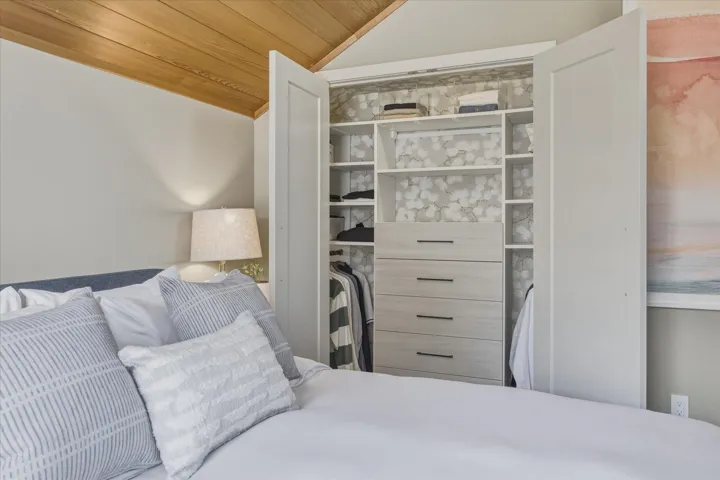 Integrated closet system featuring custom shelving and drawers
