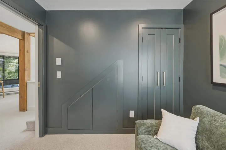 Integrated wall storage with paneled doors and sleek pull handles