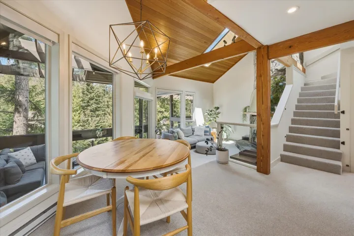 Vaulted wood-finish ceiling with exposed beams and skylight
