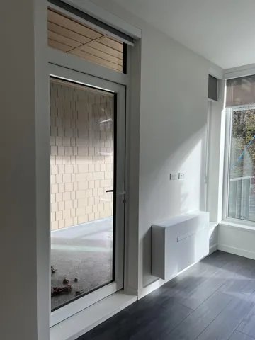 Detailed view of wood finished floors and baseboards