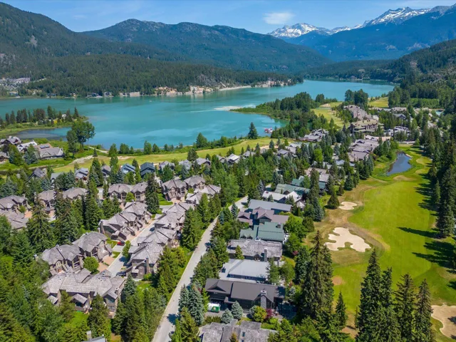 Aerial perspective of suburban area with a water and mountain view