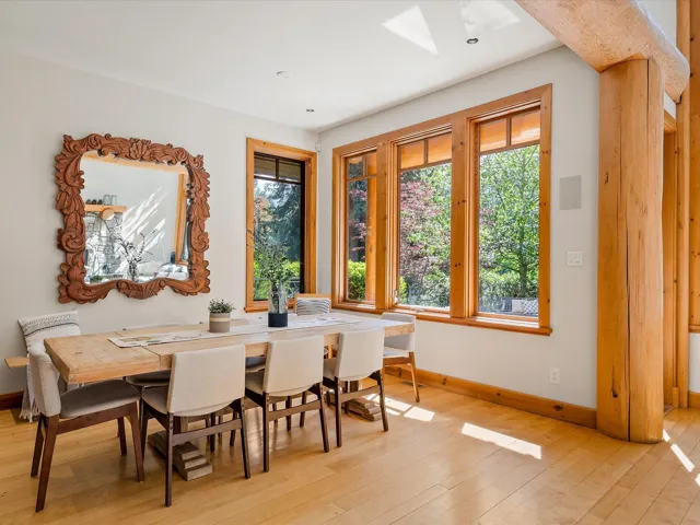 Dining room featuring healthy amount of natural light, light wood-style flooring, and a skylight
