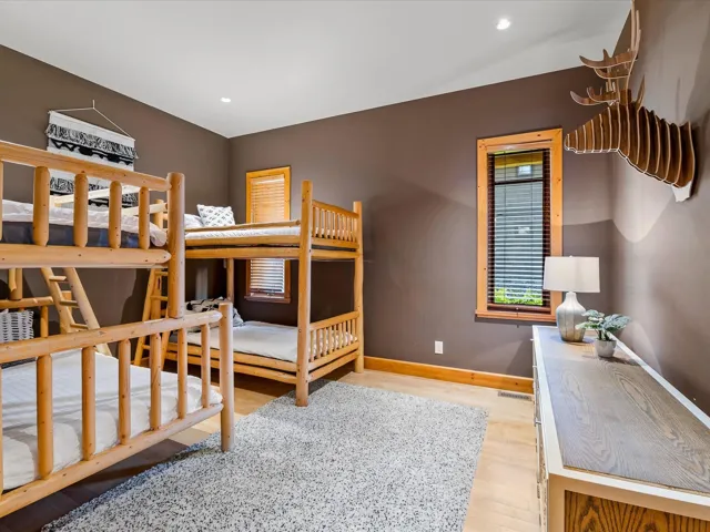 Bedroom with light wood-style floors and recessed lighting