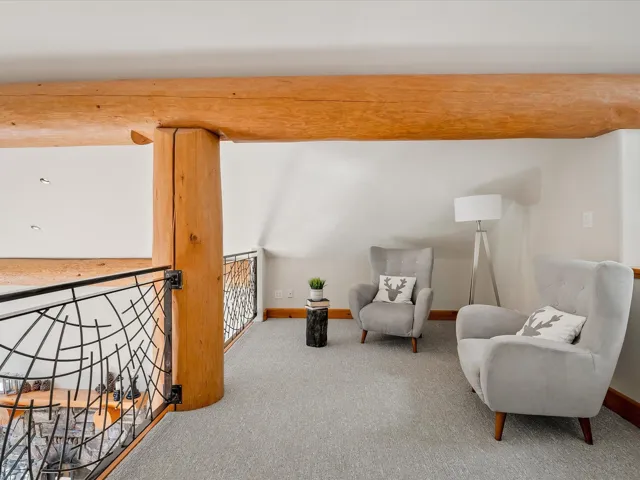 Sitting room with carpet flooring and baseboards