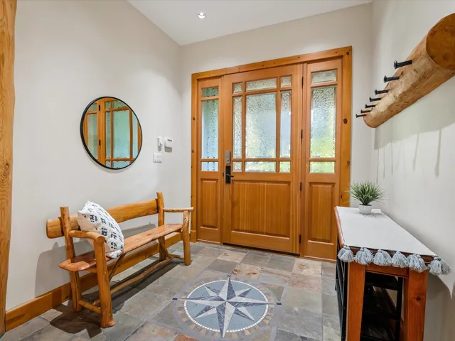 Foyer featuring stone tile floors and recessed lighting