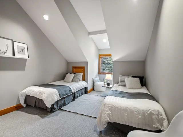 Bedroom with lofted ceiling, carpet flooring, and recessed lighting