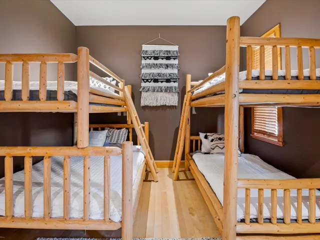 Bedroom with hardwood / wood-style flooring