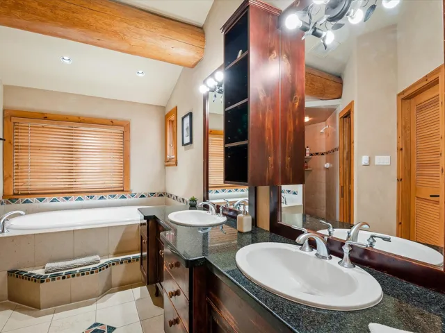 Bathroom with light tile patterned floors, a tile shower, a garden tub, and recessed lighting
