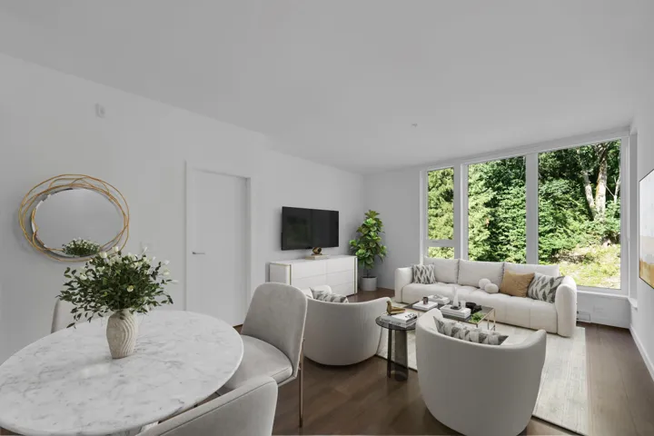 Living area with dark wood-style flooring and baseboards