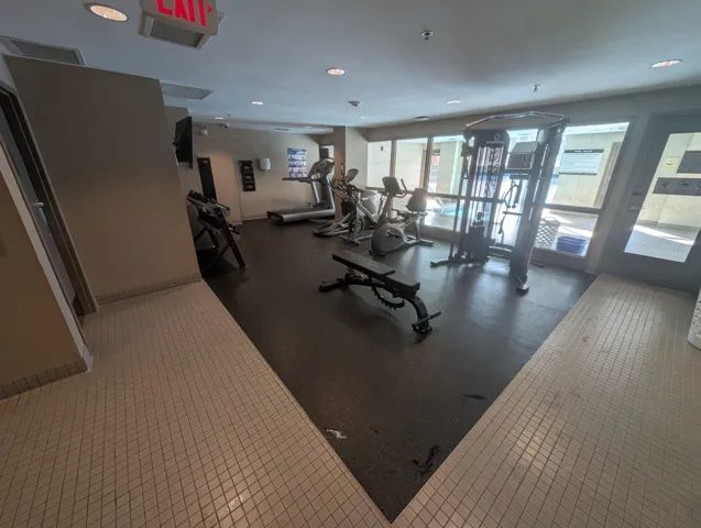 Exercise room featuring recessed lighting