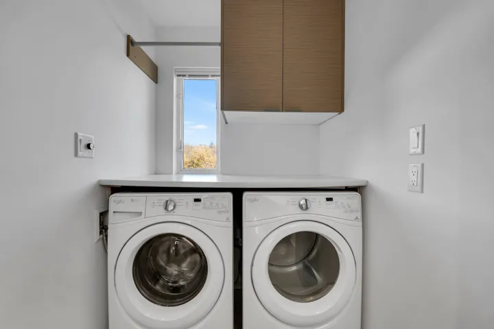 Laundry area featuring cabinet space and independent washer and dryer
