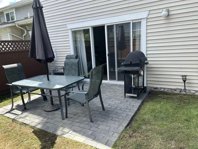 Rear patio with gray paver flooring