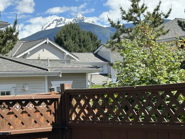 Lattice-top wood fence providing separation