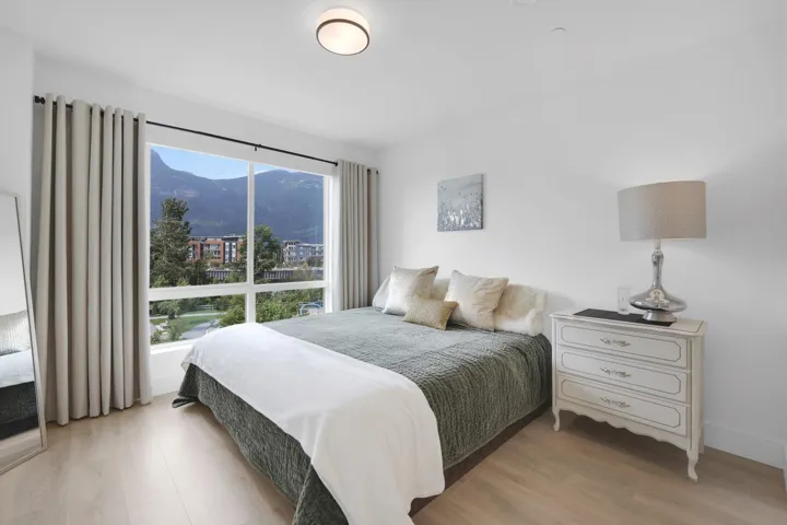 Bedroom featuring wood finished floors and a mountain view