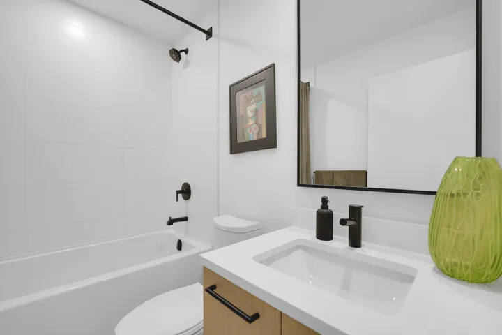 Bathroom featuring vanity and shower / tub combination