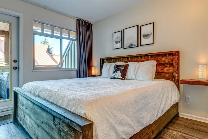 Bedroom with baseboards and wood finished floors