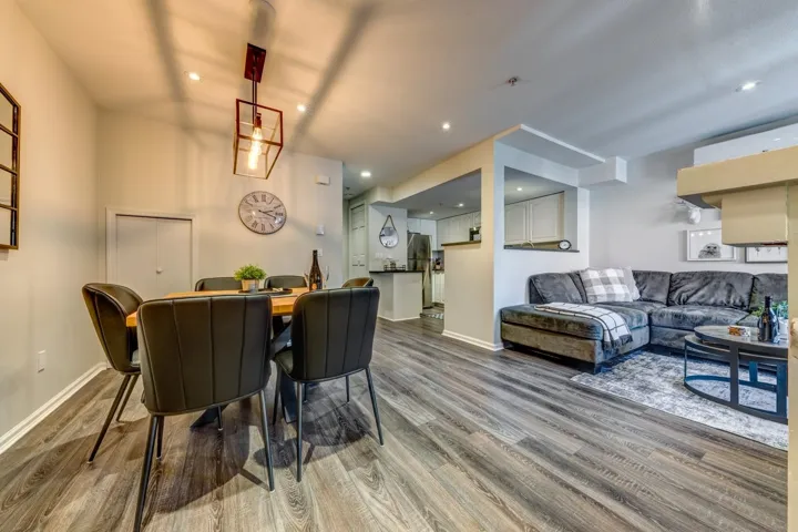 Dining space with baseboards, wood finished floors, and recessed lighting