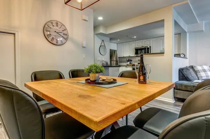 Dining space with recessed lighting and wood finished floors