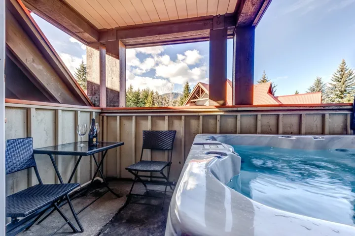 Exterior space with a hot tub