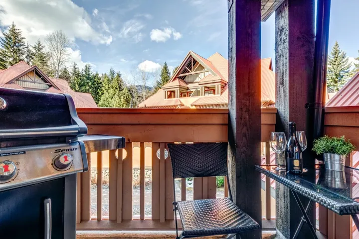 Wooden terrace featuring grilling area