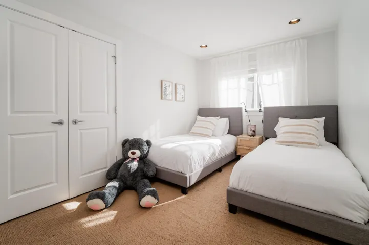 Bedroom featuring carpet, recessed lighting, and a closet