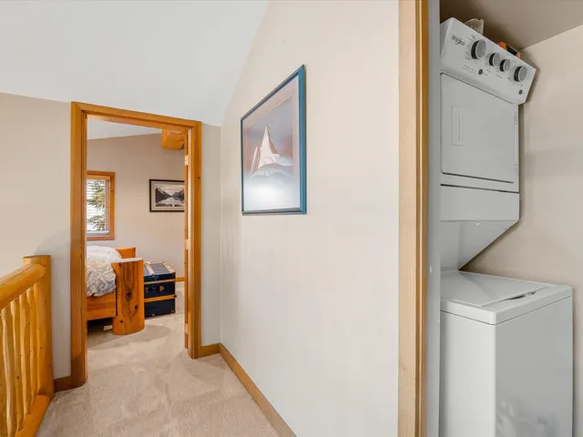 Laundry is located on the top floor between the primary and secondary bedrooms.