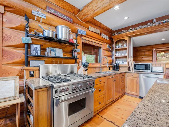 Wolf gas range and granite countertops.
