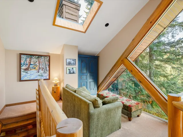 Third floor loft with views for miles! Lots of natural light. Vaulted ceilings and massive windows!