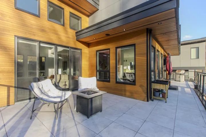 View of patio / terrace featuring an outdoor fire pit and a grill