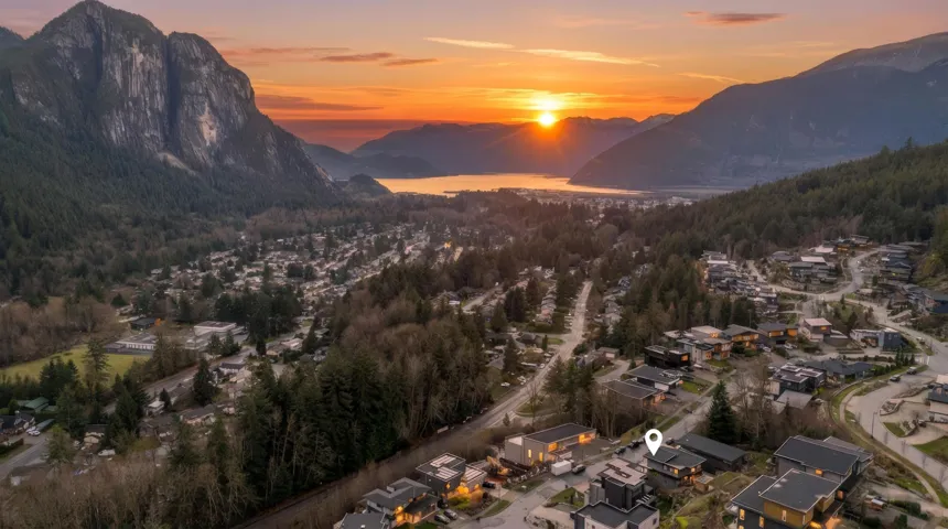Mountain view with a large body of water and nearby suburban area