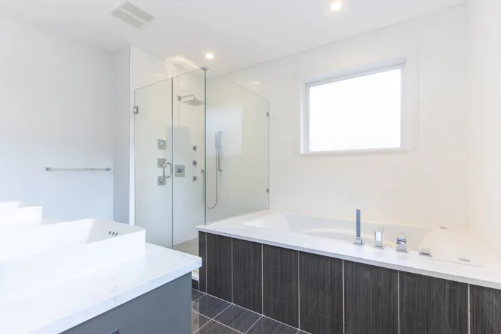 Bathroom featuring a bath, vanity, and a stall shower