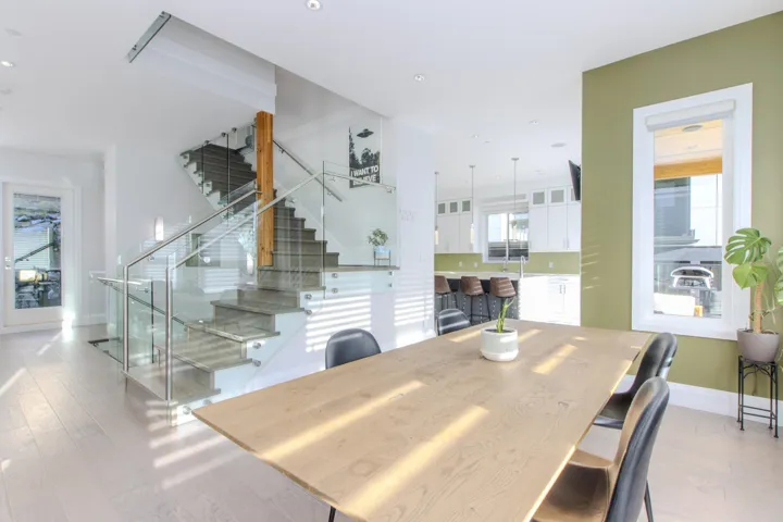 Dining space featuring plenty of natural light, stairway, recessed lighting, and light wood-type flooring