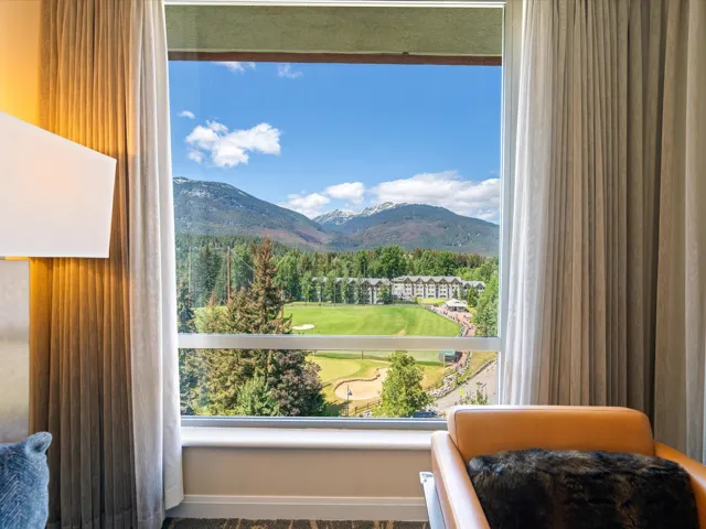 View of mountain background featuring a local golf course