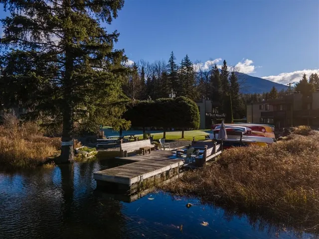 Dock featuring a water and mountain view